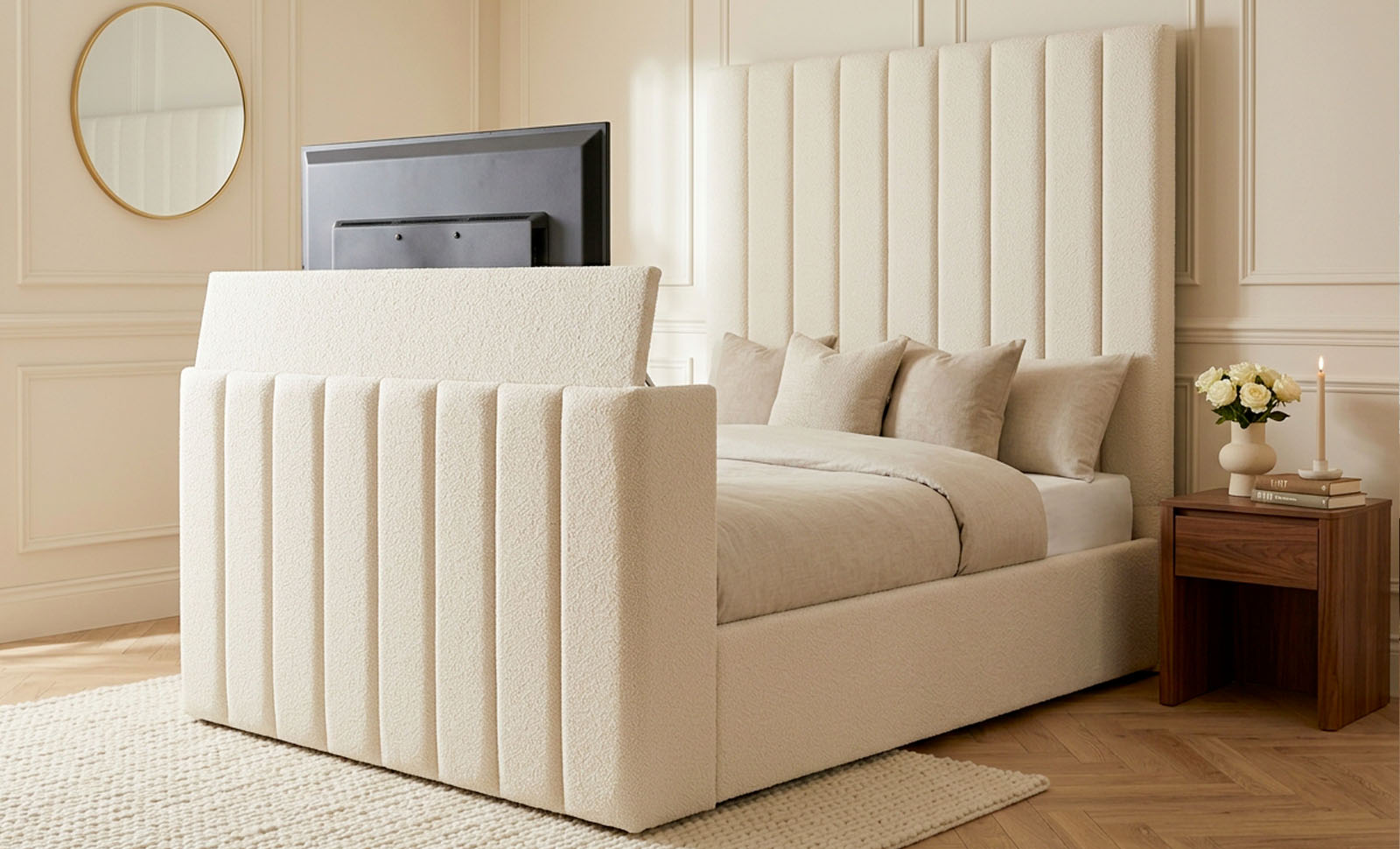 Upholstered TV bed with a television at the foot of the bed