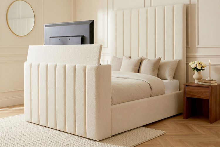 Handmade upholstered TV bed with a television at the foot of the bed, made in Yorkshire